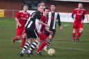 ON THE BALL: Middlezoy player Charlie White (black and white kit), with Chard goalscorer James Boyland in close attention. All pics: Steve Richardson