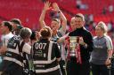 Manchester United manager Marc Skinner with the trophy after his side won the Women’s FA Cup (Adam Davy/PA)