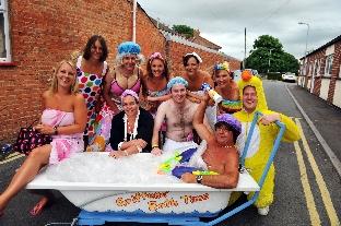 HAVIN' a bath: Carnivalites dressed up in wacky costumes to rash cash in Cavaliers CC's Pram Race.