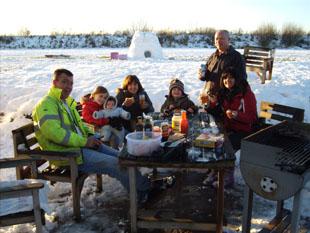 The Lane family enjoying a barbecue in the snow.