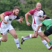 MAN-of-the-match George Day on the charge for the Vikings against Cheltenham Phoenix
