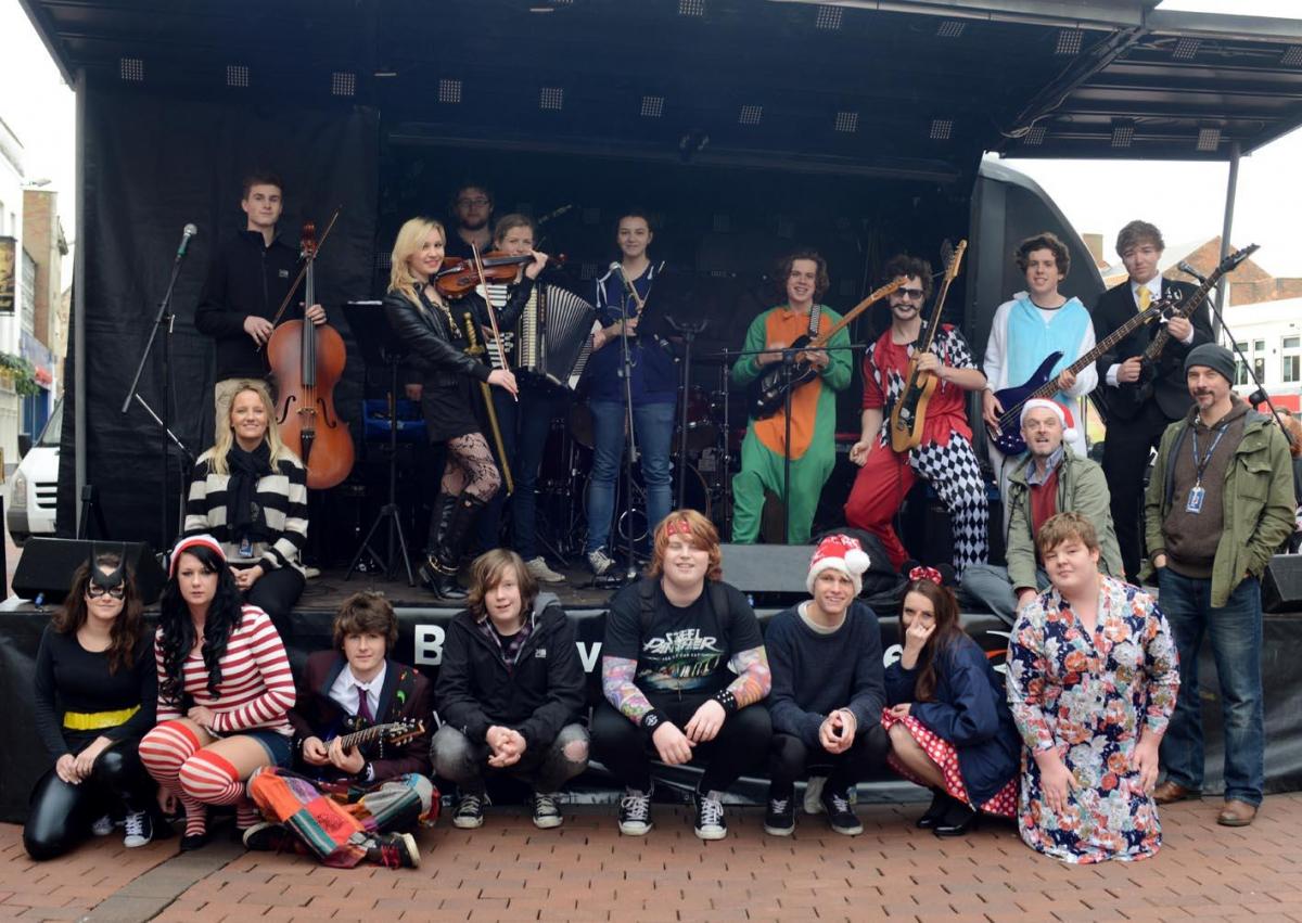 GEMMA Bolt, head of music, with A level, BTec and Music Academy students performing by The
Cornhill. PHOTO: Geoff Hall
