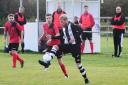 CONTROL: Middlezoy Rovers Reserves' Adam Prescott (black and white kit) on the ball during Saturday's match with Burnham United (all pics: Steve Richardson)