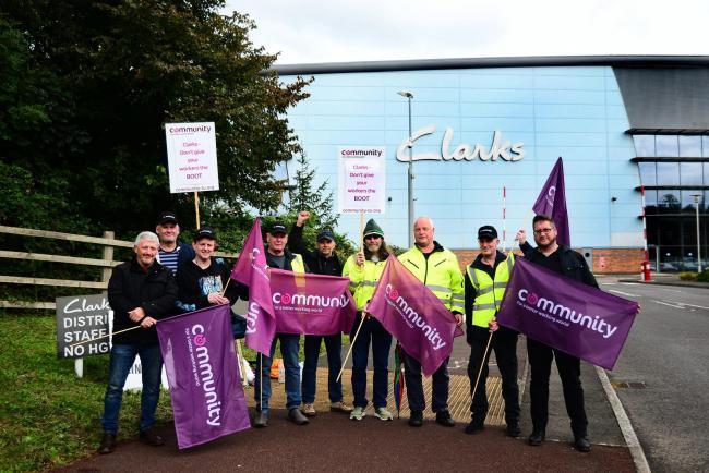 ON STRIKE: Workers outside the Clarks building in Street