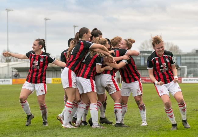 JUBILATION: The girls celebrate after Laura Holden's goal (All photos: Debbie Gould)