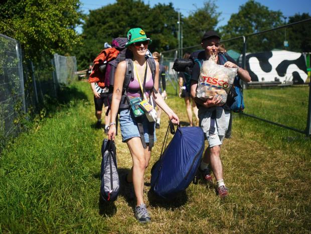 Bridgwater Mercury: People arrive on the first day of the Glastonbury Festival at Worthy Farm in Somerset (PA/PA Wire. Photo by Yui Mok