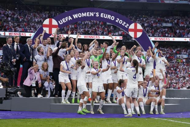 Bridgwater Mercury: England players celebrate with the trophy following victory over Germany in the UEFA Women's Euro 2022 final at Wembley Stadium, London. Picture date: Sunday July 31, 2022.