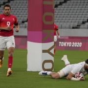 COMEBACK: Ollie Lindsay-Hague (red kit) looks on as Danny Barrett scores for the USA... but Great Britain would have the last laugh (AP Photo/Shuji Kajiyama).