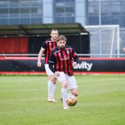 Skipper Mark Armstrong on the ball