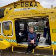 Sharon Rayner pictured sat in a Dorset and Somerset Air Ambulance helicopter.