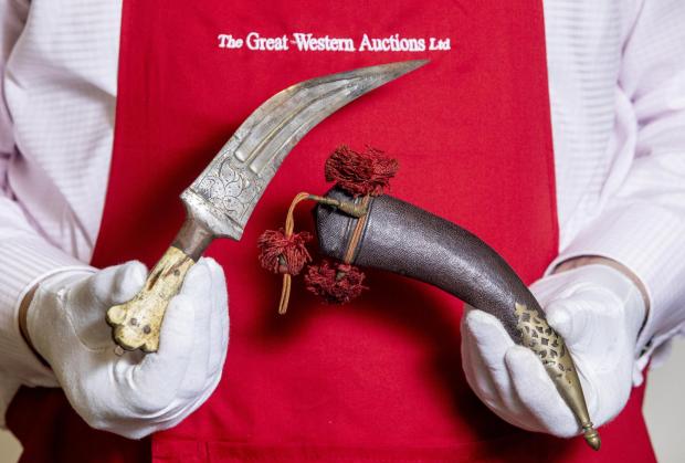 Bridgwater Mercury: AUCTION: The Arabian Janbiya dagger with bone handle (estimate: £8,000-10,000) belonging to T.E. Lawrence (Lawrence of Arabia). Picture: SWNS